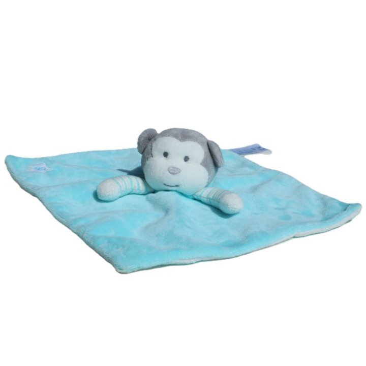 gros plan tête du singe du doudou plat turquoise